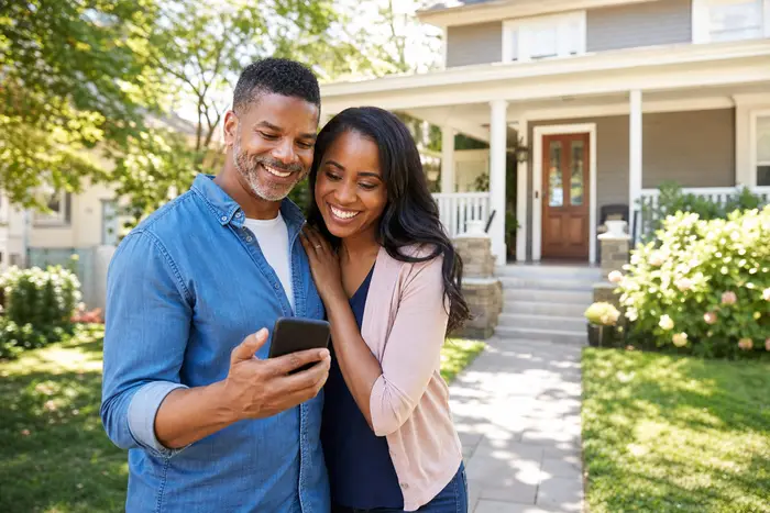 Couple celebrating a fast cash offer
